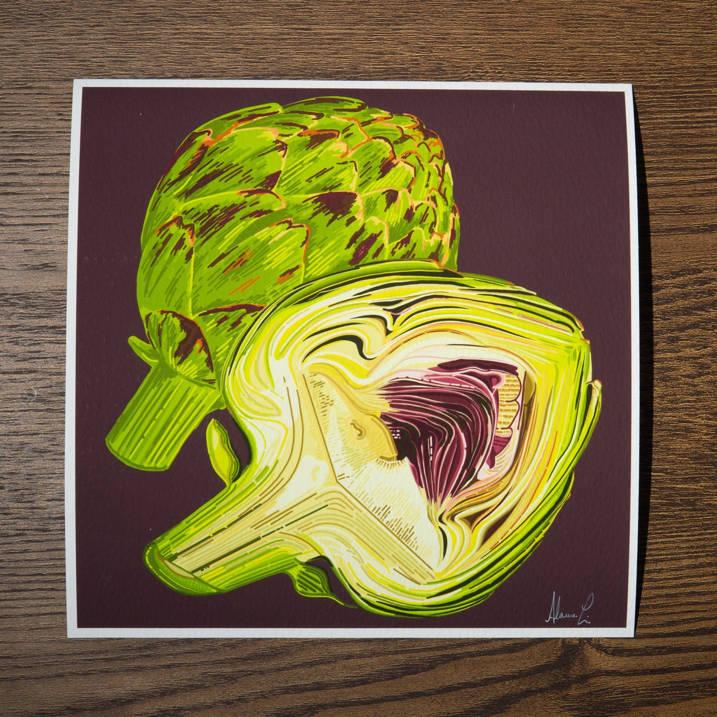 an 8 by 8 Heartichoke print signed in the lower right on a dark wine-colored background with a thin white border